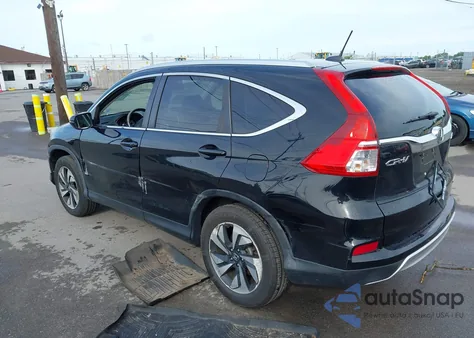 2015 Honda Cr-V Touring z USA, uszkodzony, nr VIN 5J6RM4H91FL110238